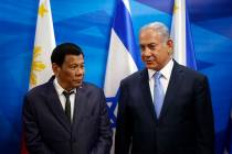 Israeli Prime Minister Benjamin Netanyahu, right, stands next to Philippine President Rodrigo D ...