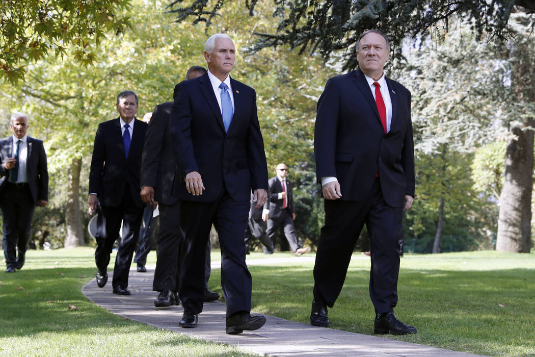Vice President Mike Pence, left, and Secretary of State Mike Pompeo leave the Ambassador&#x2019 ...
