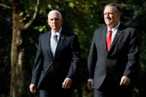 Vice President Mike Pence, left, and Secretary of State Mike Pompeo leave the Ambassador&#x2019 ...