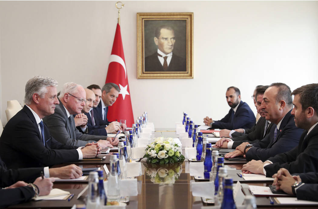 Turkish Foreign Minister Mevlut Cavusoglu, second right, and U.S. National Security Advisor Rob ...