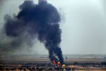 In this photo taken from the Turkish side of the border between Turkey and Syria, in Ceylanpina ...