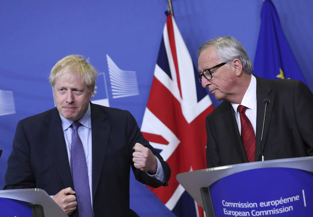 British Prime Minister Boris Johnson gestures as he stands alongside European Commission Presid ...