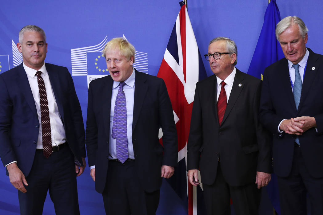Britain's Brexit Secretary Stephen Barclay (from left), British Prime Minister Boris Johnson, E ...