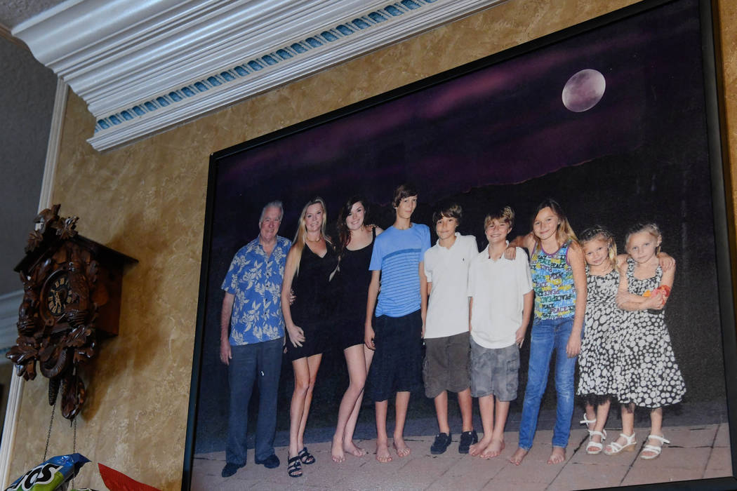 A portrait of the Siegel family hangs in the kitchen of their home in Windermere, Fla. on Oct. ...