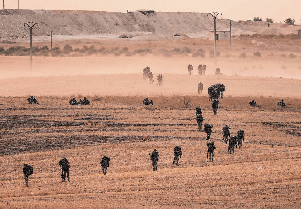 In this Monday, Oct.14, 2019 photo made available Tuesday, Oct. 15, 2019, Turkey's forces advan ...