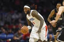 Los Angeles Clippers center Montrezl Harrell dribbles against Melbourne United during a preseas ...