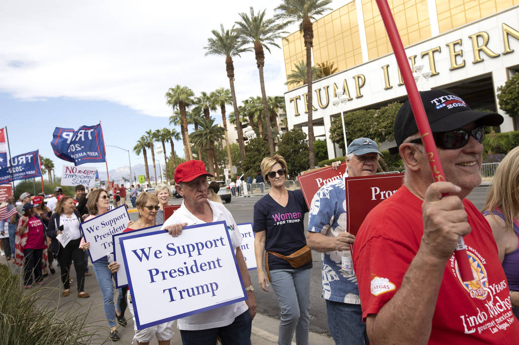 The March for Trump travels past Trump International Hotel on Thursday, Oct. 17, 2019, in Las V ...