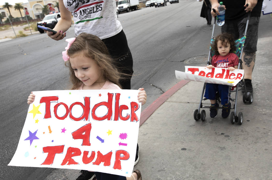 Lucy Biassotti, left, and Benny Biassotti came out to the March for Trump with their parents on ...