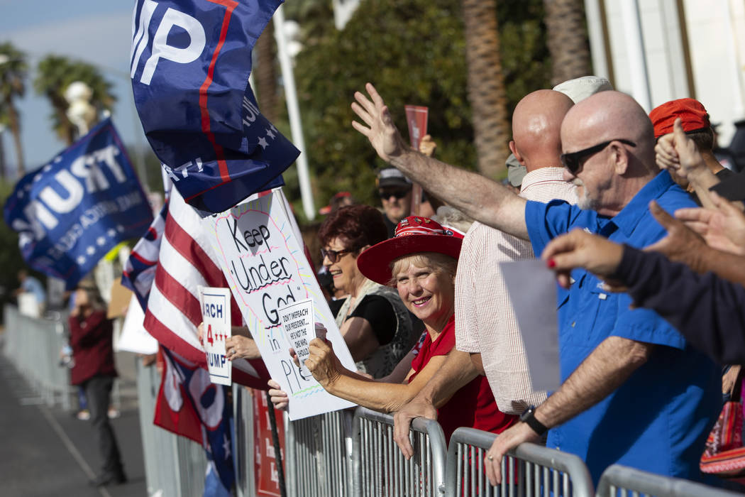 Trump supporters cheer as vehicles honk at the March for Trump on Thursday, Oct. 17, 2019, outs ...