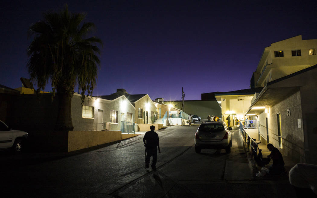 Anthony Lowe, who has been homeless since last December, center, walks around The Salvation Arm ...