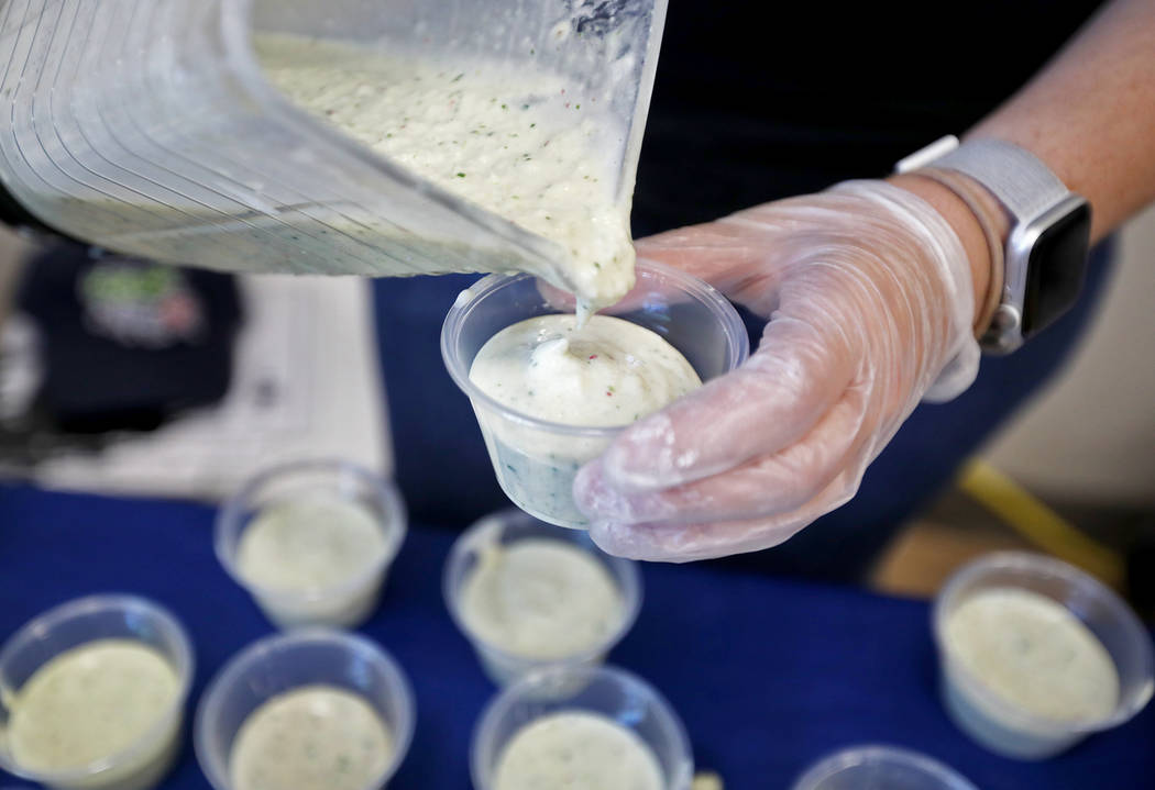 Melanie Thornton, a volunteer with the Dairy Council of Nevada, pours a smoothie for students a ...