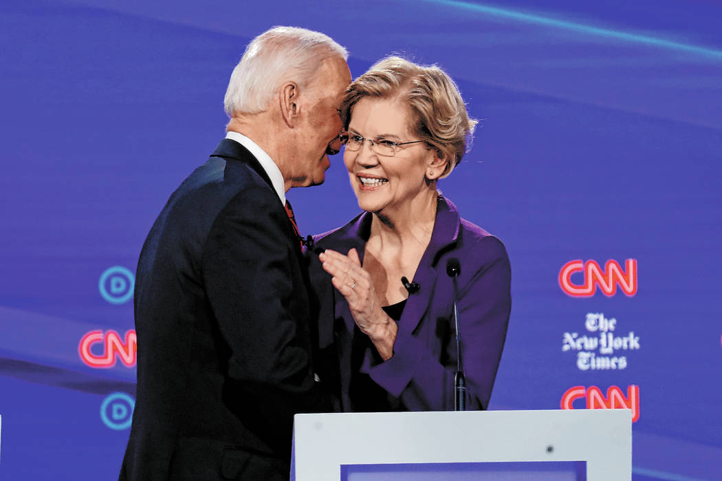 Democratic presidential candidate former Vice President Joe Biden, left, talks with Sen. Elizab ...