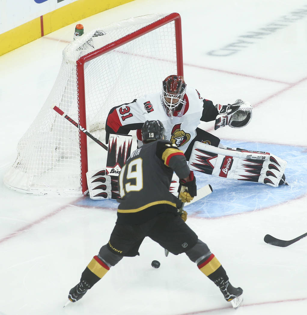 Golden Knights' Reilly Smith (19) lines up his shot to score past Ottawa Senators goaltender An ...