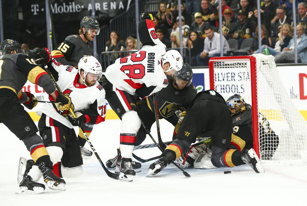 Ottawa Senators' Connor Brown (28) tries to get the puck in against the Golden Knights during t ...