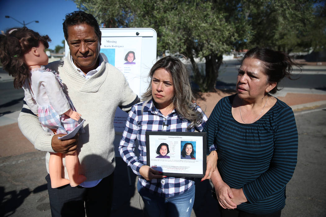 Rosy Rodriguez, center, with her parents Ramon Rodriguez, left, and Elia Zepeda, participate in ...