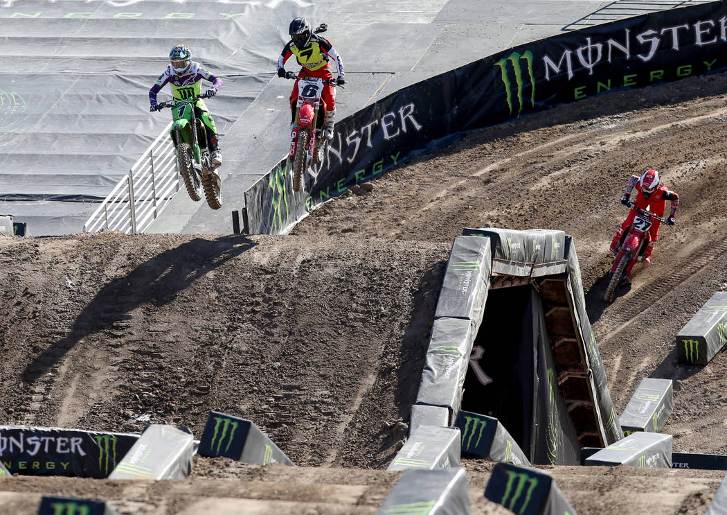 Supercross riders, including Eli Tomac (1) of Cortez, Colo., left, and Jeremy Martin (6) of Mil ...