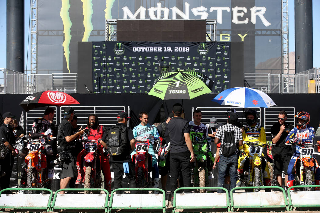 Supercross riders, including Eli Tomac (1) of Cortez, Colo., center, wait to make a test run at ...