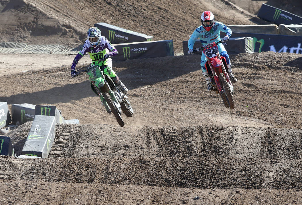 Supercross riders, including Eli Tomac (1) of Cortez, Colo., left, and Vince Friese (64) of Cap ...