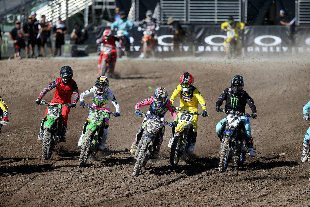 Supercross riders, including, from left, Tyler Bowers (34) of Lake Elsinore, Calif., Adam Cianc ...