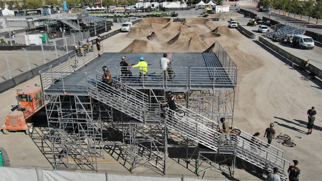 BMX riders take turns on practice runs of the track at Sam Boyd Stadium on Friday, October 18, ...