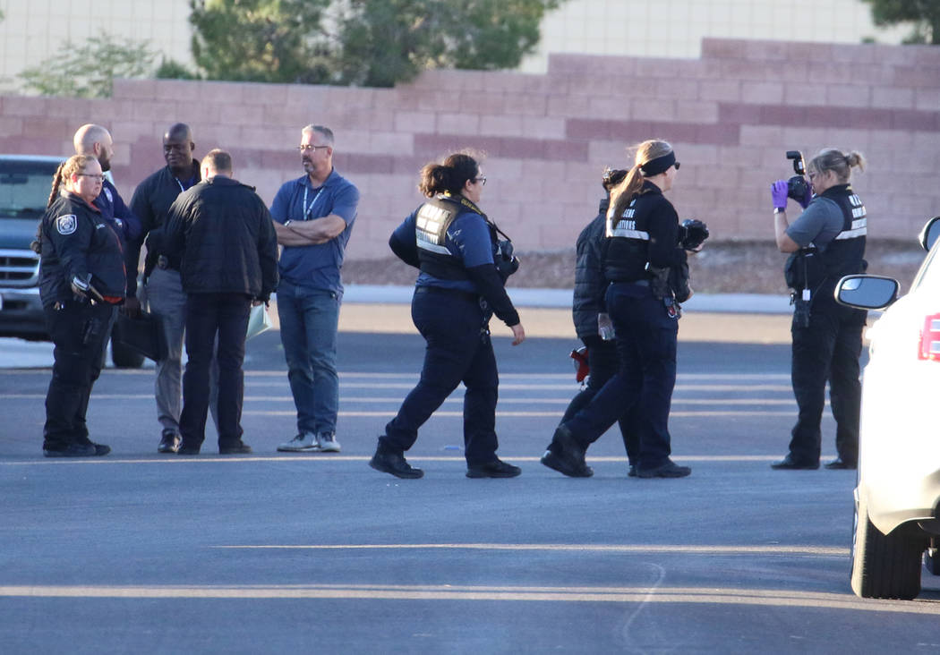Police investigate a shooting involving a North Las Vegas police officer on the 4800 block of P ...