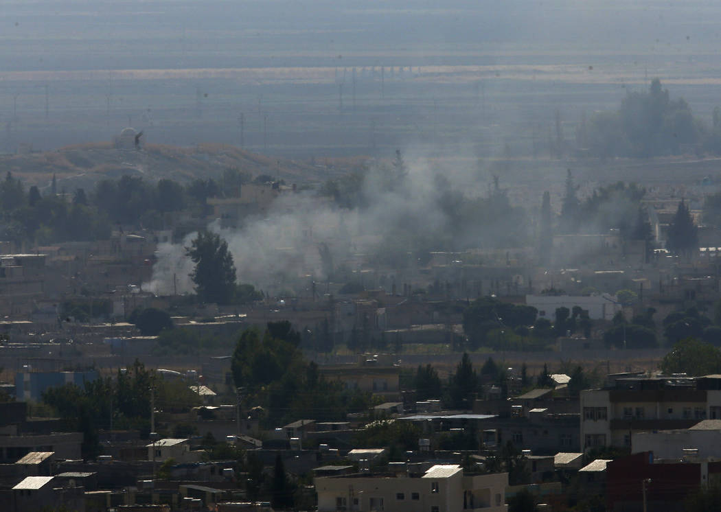 In this photo taken from the Turkish side of the border between Turkey and Syria, in Ceylanpina ...