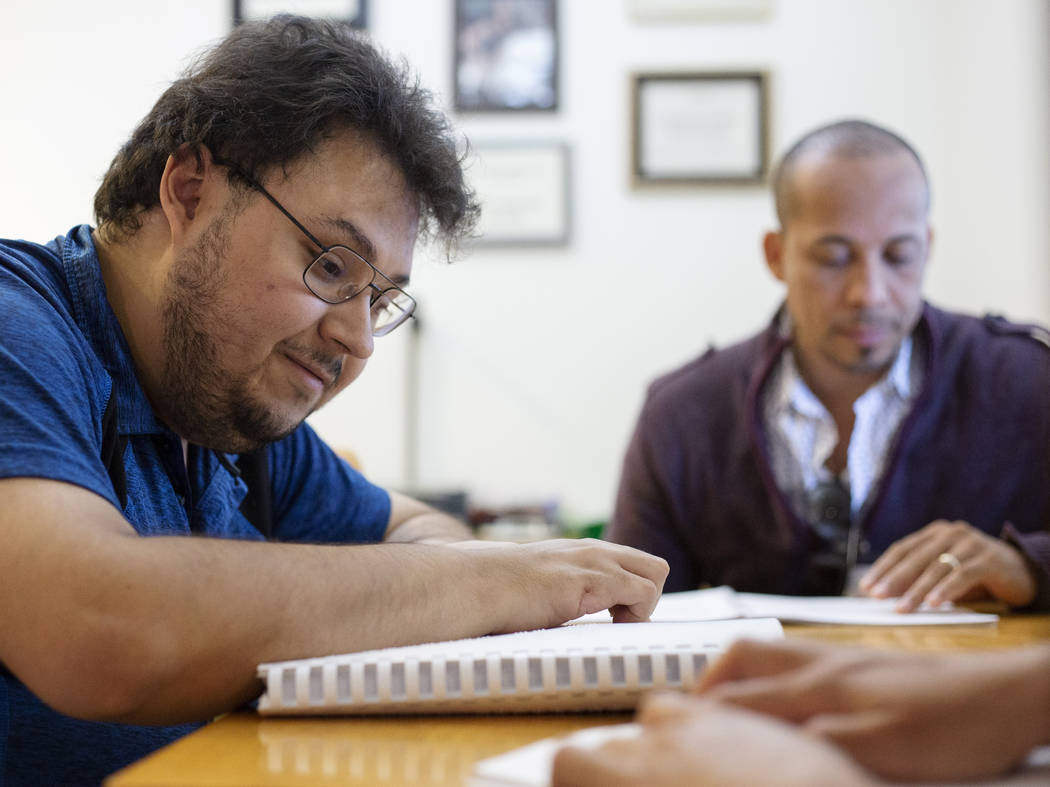 Ivan Medina, left, who is visually impaired due to retina pigmentosa, learns Braille on Friday, ...