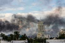 Smoke from burning cars rises due in Culiacan, Mexico, Thursday, Oct. 17, 2019. An intense gunf ...