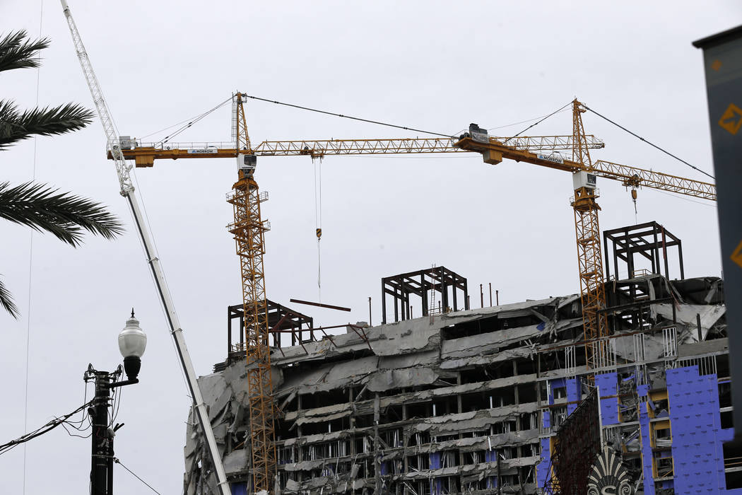 Two unstable cranes loom over the construction of a Hard Rock Hotel, Thursday, Oct. 17, 2019, i ...