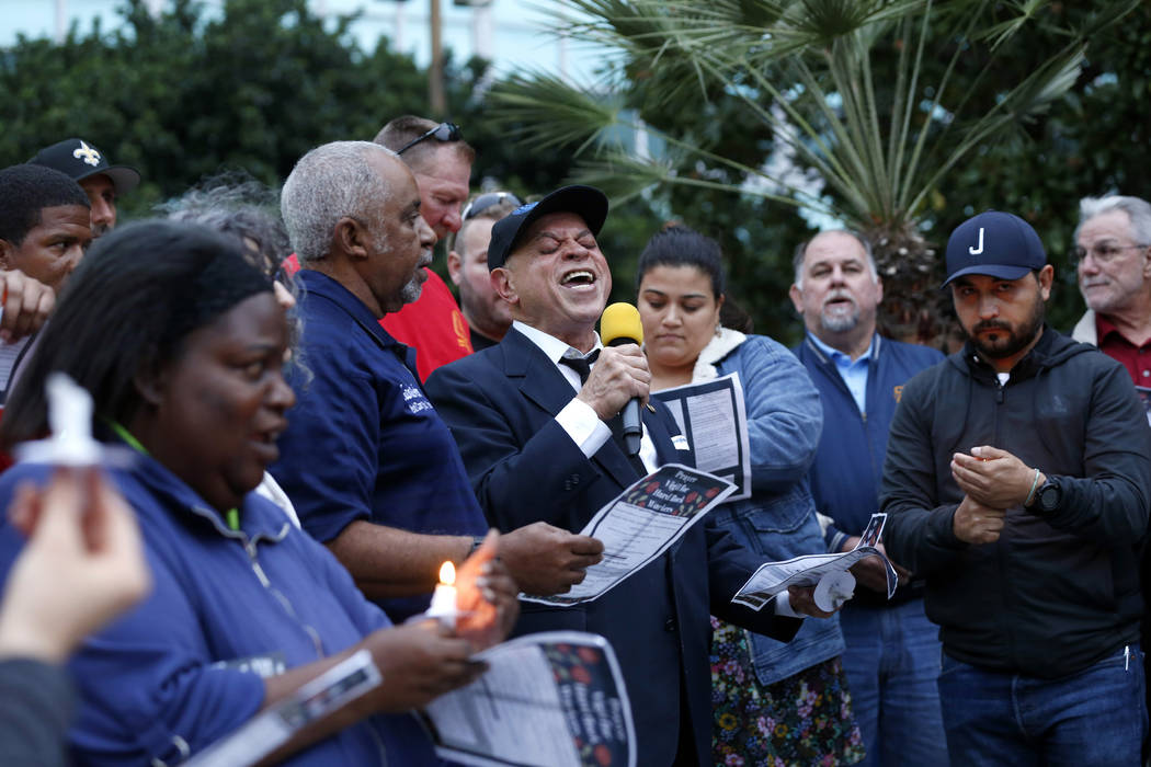 New Orleans music legend Deacon John Moore sings "Amazing Grace" during a candlelight ...