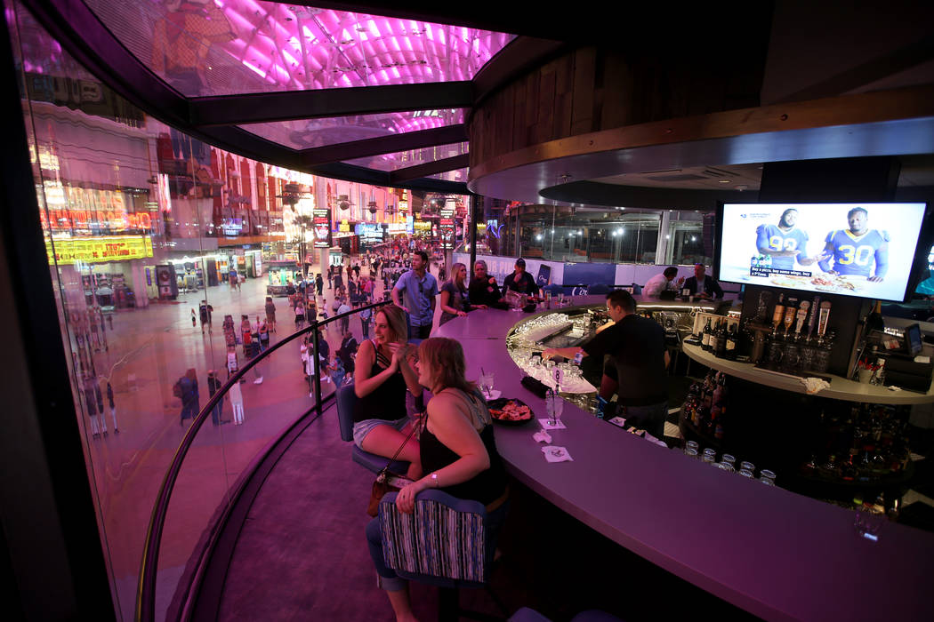 Trista Wells, left, and Sara Peterson, both of Kalispell Montana, at the rotating bar at Whiske ...