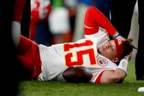 Kansas City Chiefs quarterback Patrick Mahomes (15) lies on the field after being injured again ...