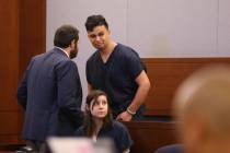 Henry Aparicio, 23, who is accused in a DUI crash that killed a man and a woman, talks to his a ...