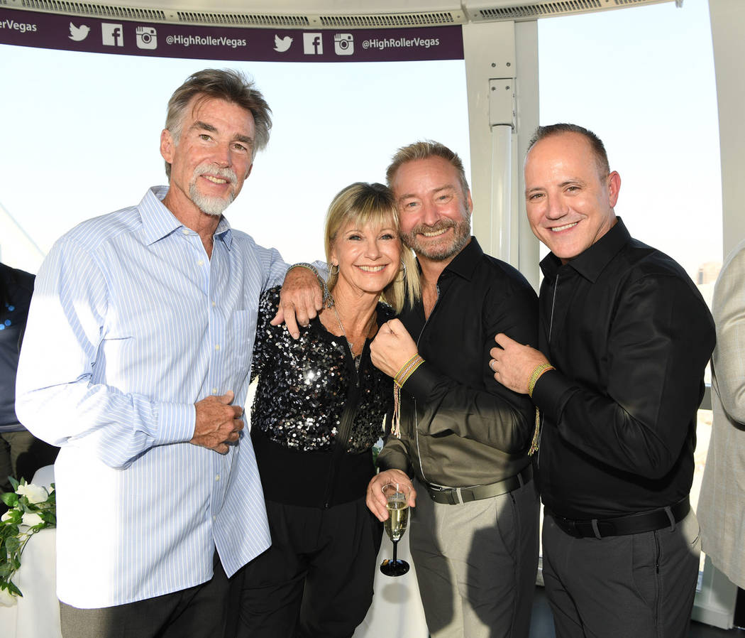 Michael Caprio and Randy Slovacek are shown with Olivia Newton-John and her husband, John Easte ...
