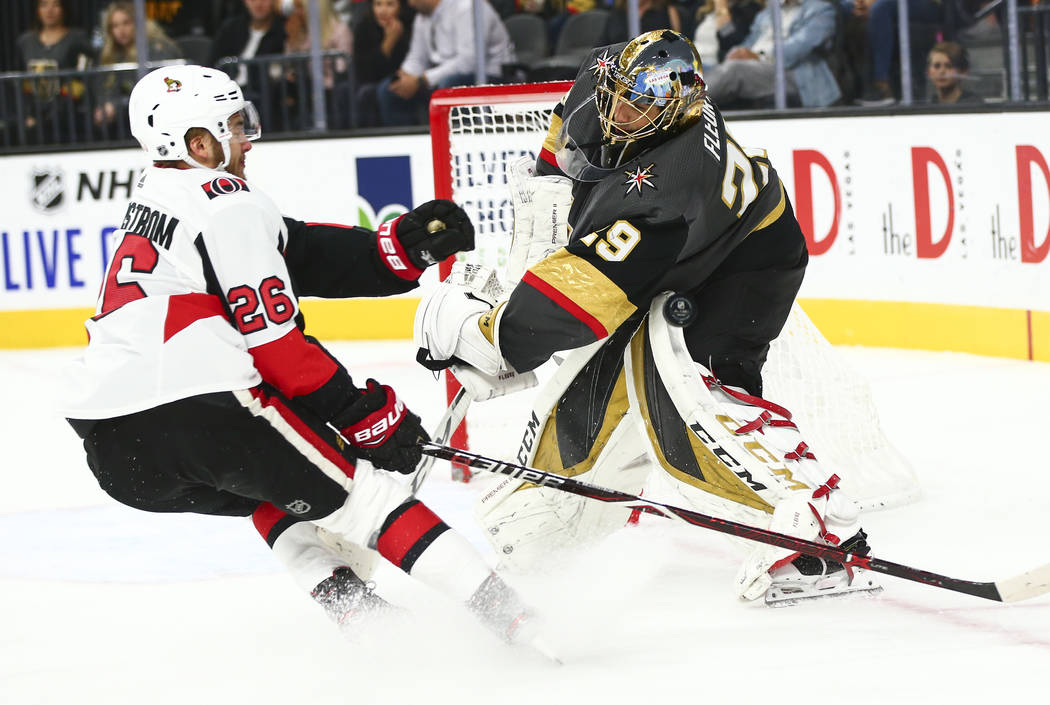 Golden Knights goaltender Marc-Andre Fleury (29) blocks the puck in front of Ottawa Senators' E ...
