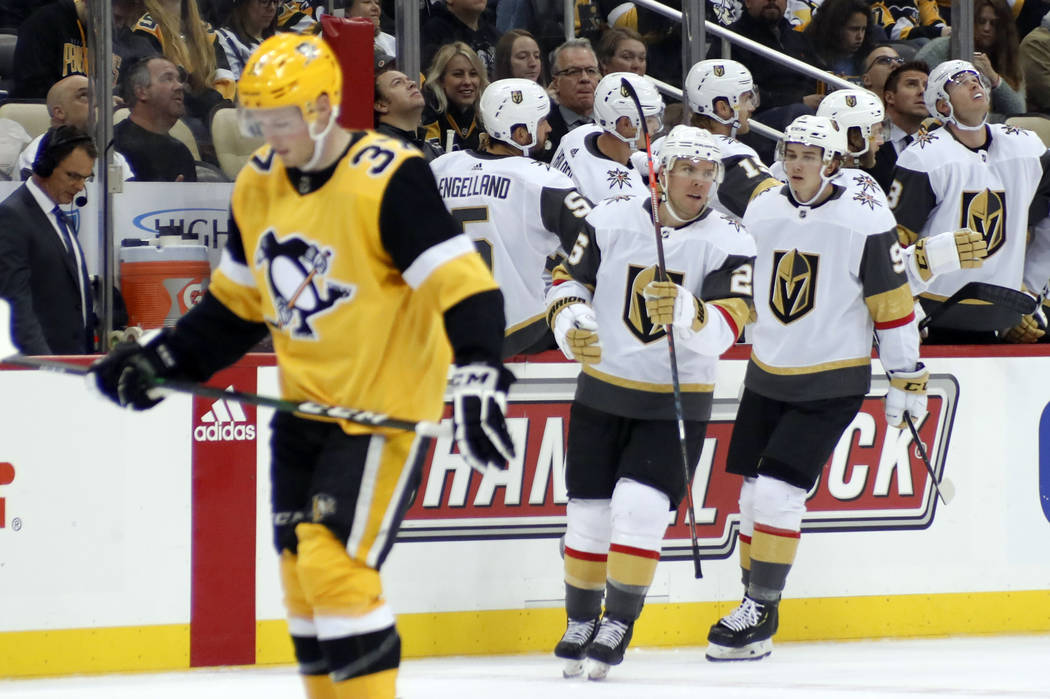 Vegas Golden Knights' Paul Stastny, center, celebrates after scoring as Pittsburgh Penguins' Sa ...