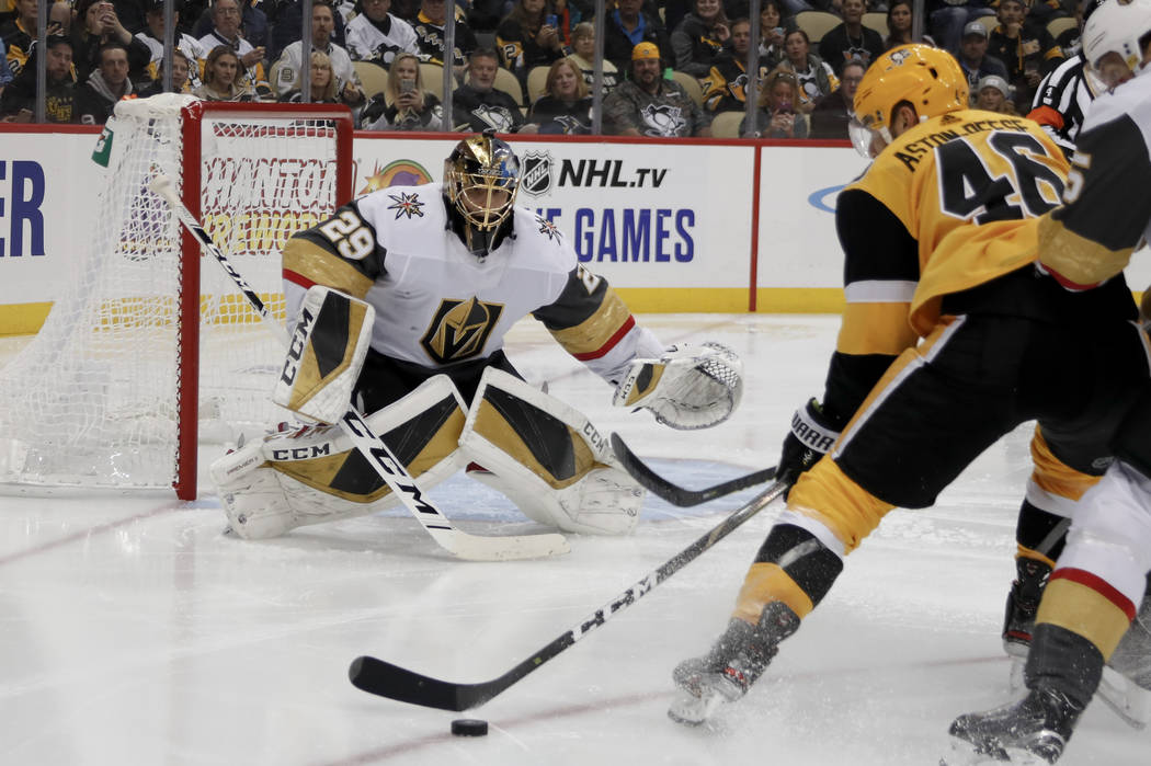 Pittsburgh Penguins' Zach Aston-Reese (46) looks to shoot on Vegas Golden Knights goaltender Ma ...