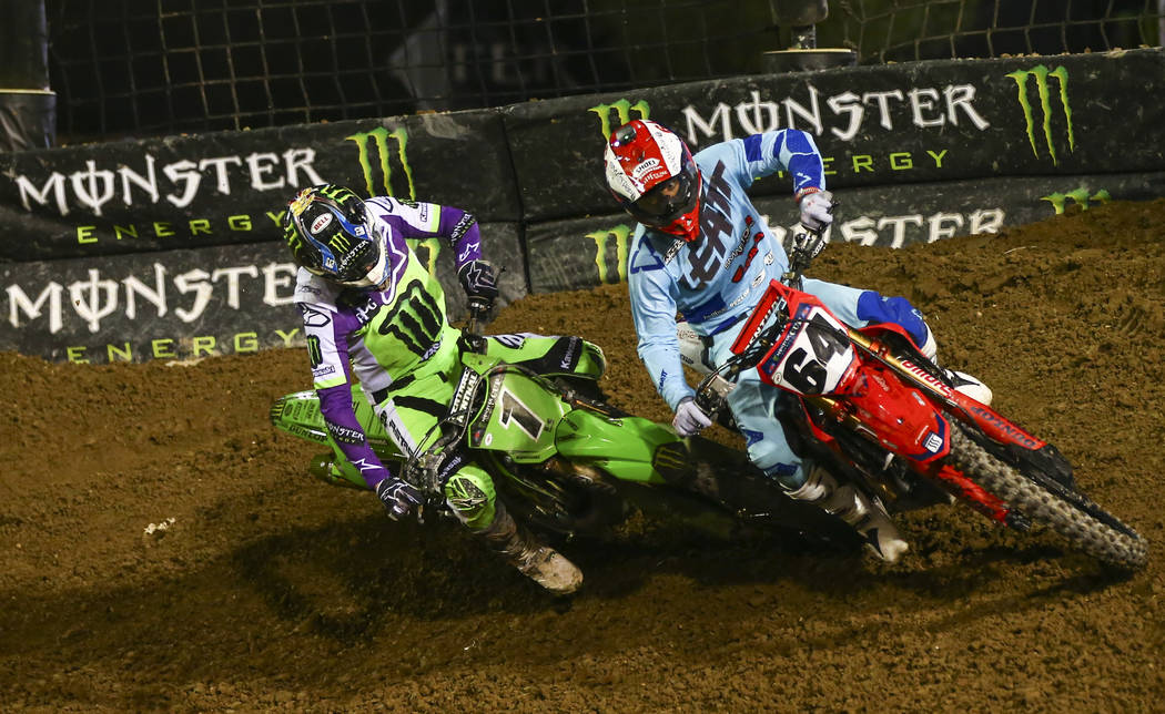 Eli Tomac (1) and Vince Friese (64) battle for position during the first round of the Monster E ...