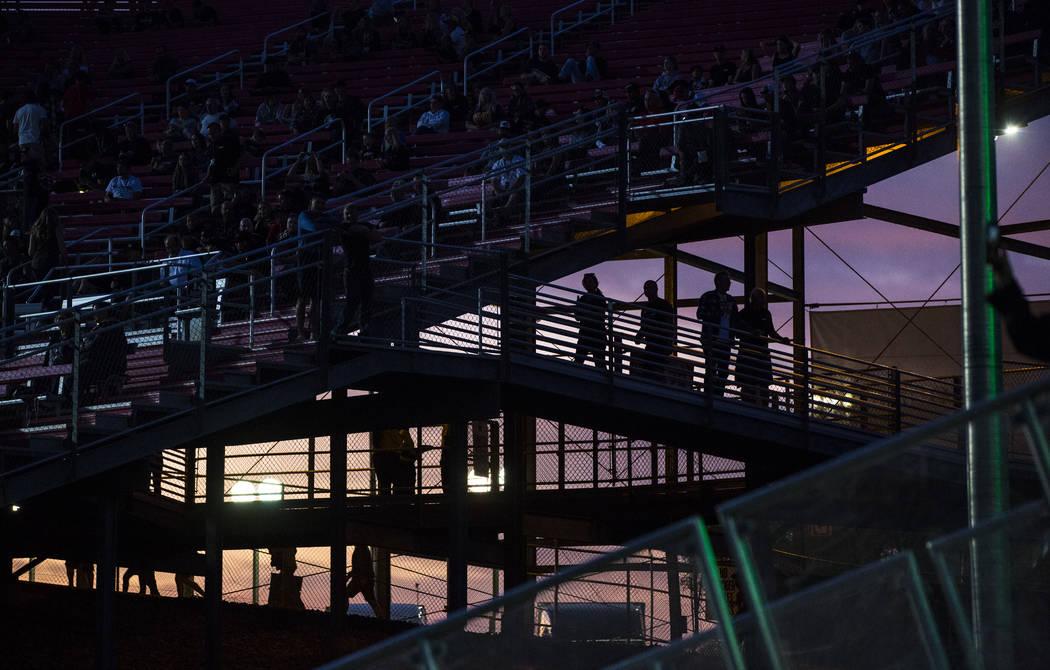 Fans are silhouetted as they arrive for the Monster Energy Cup Supercross main event at Sam Boy ...
