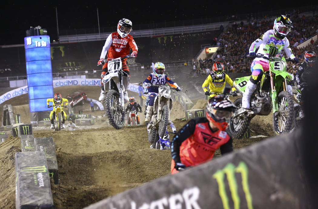 Riders compete during the second round of the Monster Energy Cup Supercross main event at Sam B ...