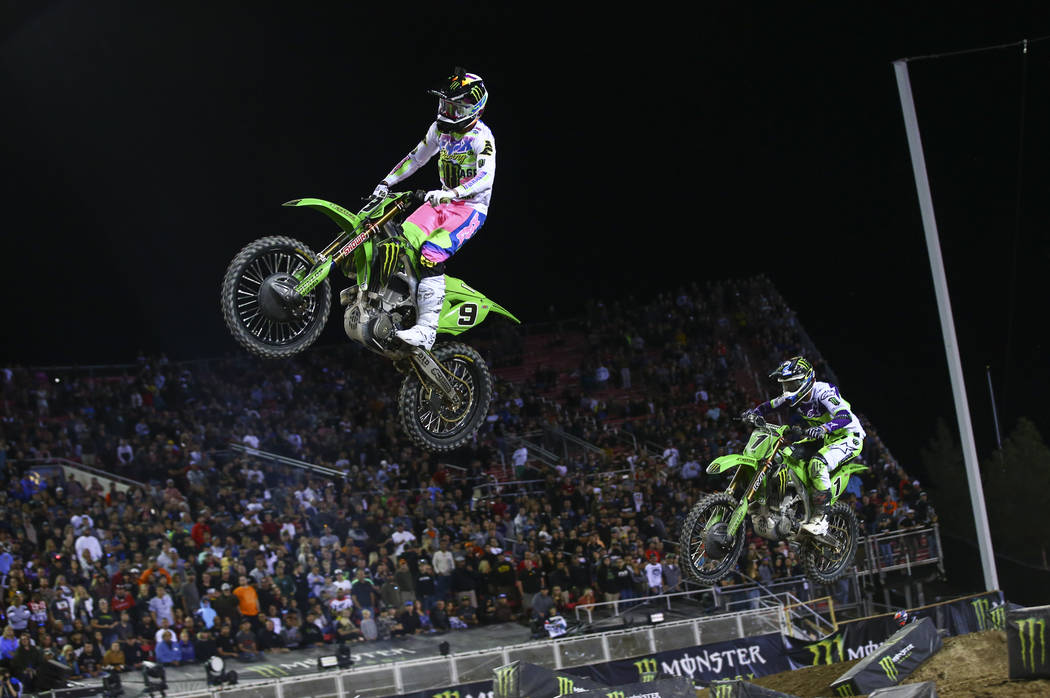 Adam Cianciarulo (9) leads the race past Eli Tomac (1) during the third main event of the Monst ...