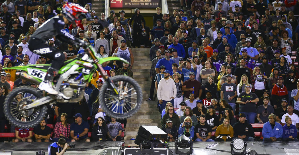 Fans watch Justin Starling (56) pass by during the third main event of the Monster Energy Cup S ...