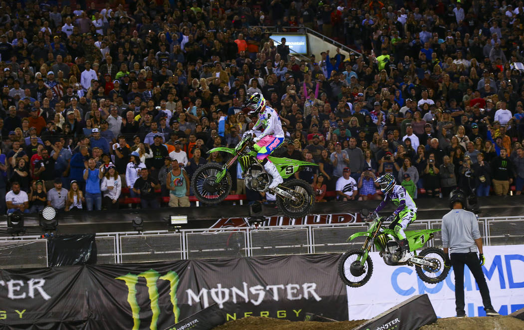 Adam Cianciarulo (9) leads the race past Eli Tomac (1) during the third main event of the Monst ...