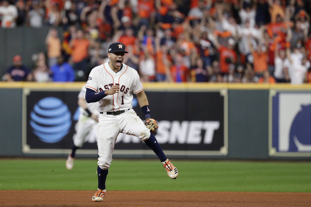 Houston Astros shortstop Carlos Correa celebrates after New York Yankees' Gary Sanchez grounded ...