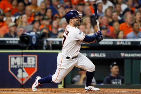 Houston Astros' Jose Altuve hits a double against the New York Yankees during the first inning ...
