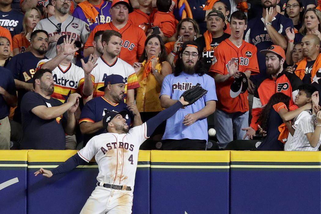 Houston Astros right fielder George Springer can't gets glove on a two-run home run by New York ...