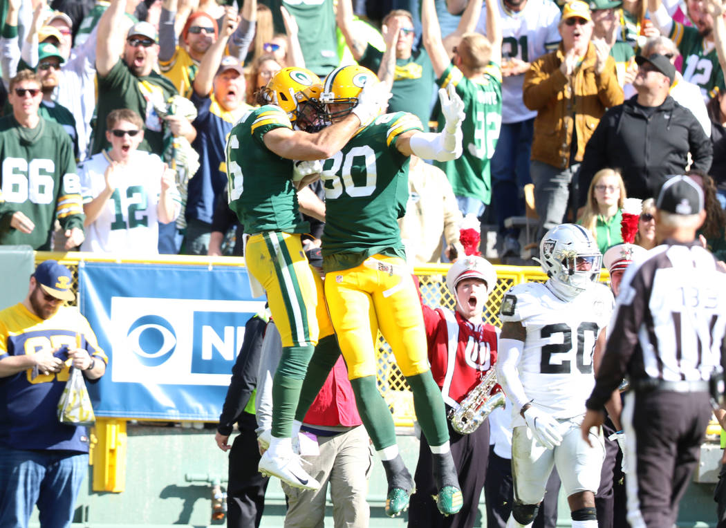Green Bay Packers wide receiver Jake Kumerow (16) celebrates his touchdown score with Green Bay ...