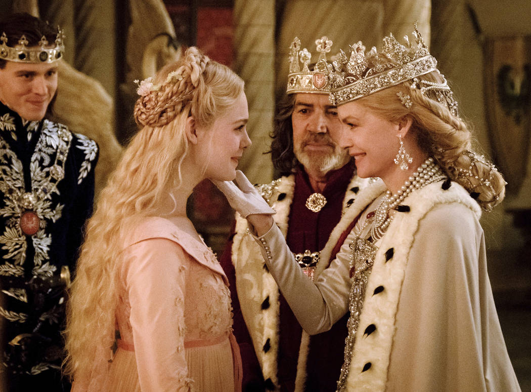 This image released by Disney shows, from left, Harris Dickinson as Prince Phillip, Elle Fannin ...