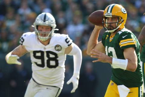 Green Bay Packers quarterback Aaron Rodgers (12) prepares to throw the football as Oakland Raid ...