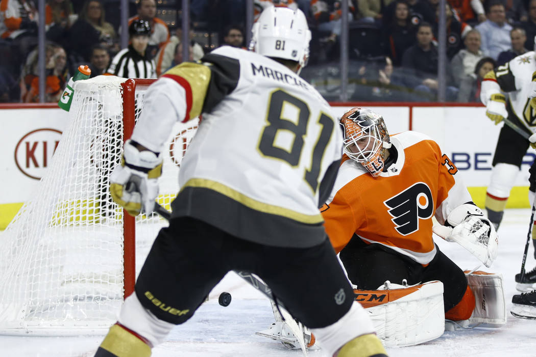 Vegas Golden Knights' Jonathan Marchessault (81) scores against Philadelphia Flyers goaltender ...